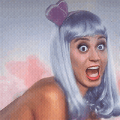 Woman In Purple Wig With Bow GIF