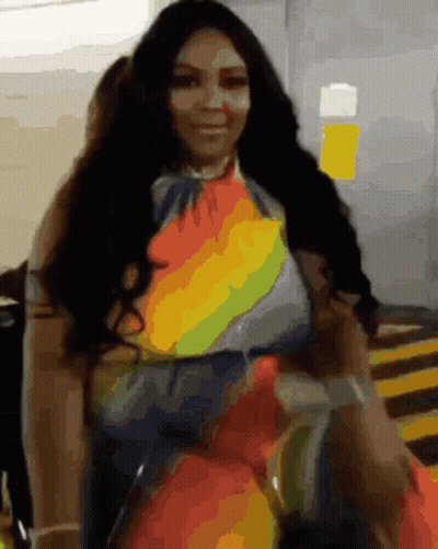 Woman In Rainbow Dress In Parking Garage GIF