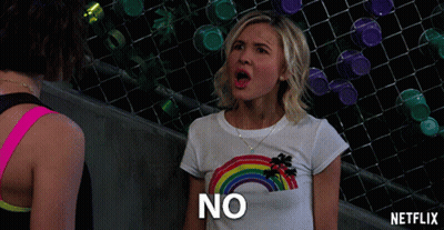 Woman In Rainbow T-Shirt Saying No GIF