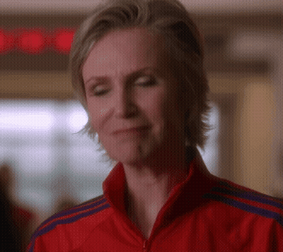 Woman In Red Adidas Jacket Looking Down GIF