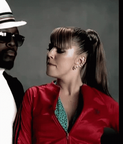 Woman In Red Adidas Jacket Next To Man With Sunglasses GIF