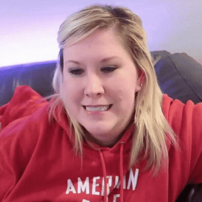 Woman In Red American Eagle Hoodie Smiling GIF