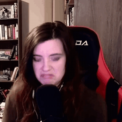 Woman In Red And Black Chair With V GIF