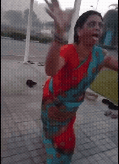 Woman in Red and Blue Dress Dancing