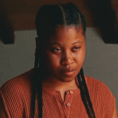 Woman In Red And Blue Striped Shirt At Desk Next To Siemens Phone GIF