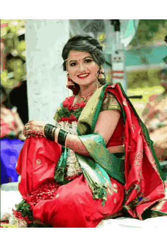 Woman In Red And Green Saree Sitting On Bed Sticker