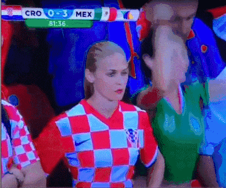 Woman In Red And White Checkered Shirt Facing Cro 0-3 Mex Screen GIF