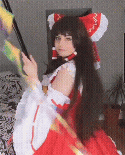 Woman In Red And White Dress And Headband GIF