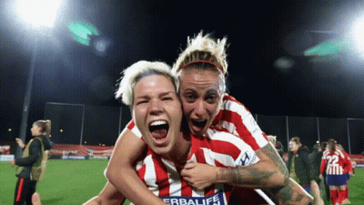 Woman In Red And White Herbalife Jersey Holding Another On Shoulders GIF