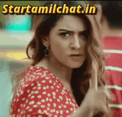 Woman In Red And White Polka Dot Dress Looking At Camera Startamilchat.in GIF
