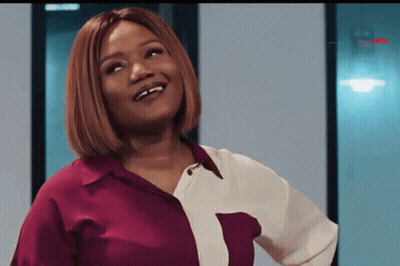 Woman In Red And White Shirt Smiling Up GIF
