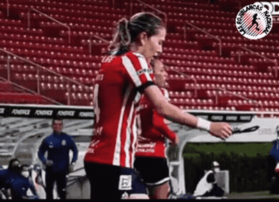Woman In Red And White Striped Shirt On Soccer Field GIF
