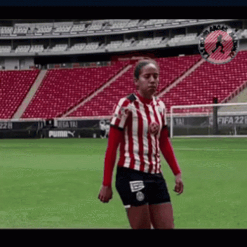 Woman In Red And White Striped Shirt On Soccer Field GIF