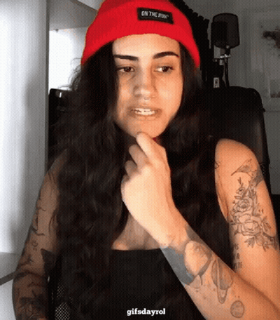 Woman In Red Beanie Saying On The Run GIF