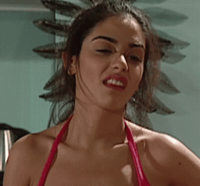 Woman In Red Bikini Making Funny Face GIF