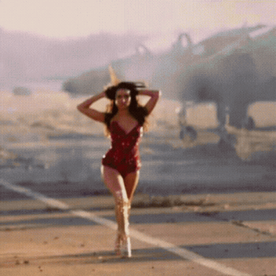 Woman In Red Bodysuit And Boots Walking GIF