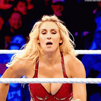 Woman In Red Bra Standing In Wrestling Ring GIF