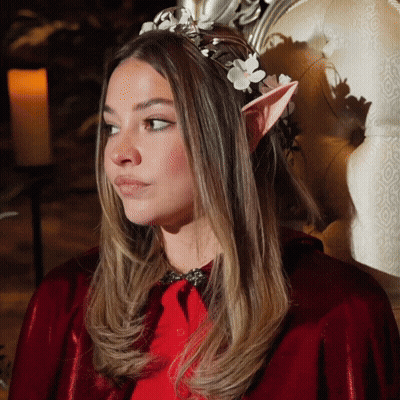 Woman In Red Cape And Elf Ears With Flower Crown GIF