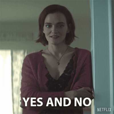 Woman In Red Cardigan With Yes And No Sign GIF