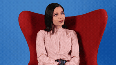 Woman In Red Chair Looking Up GIF