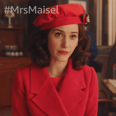 Woman In Red Coat And Beret Asking What's Going On GIF