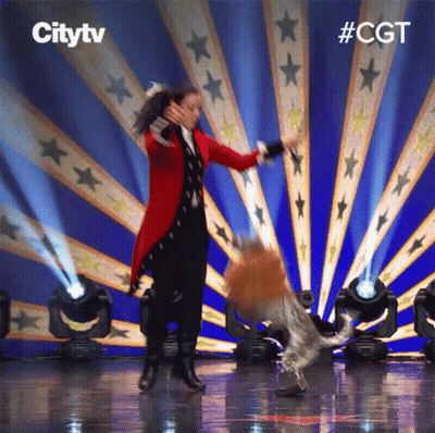 Woman In Red Coat Dancing With Dog Citytv Logo GIF