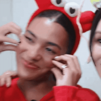 Woman In Red Crab Headband With Ring GIF
