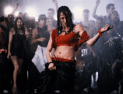 Woman In Red Dancing In Front Of Crowd With Man In 27 Shirt GIF