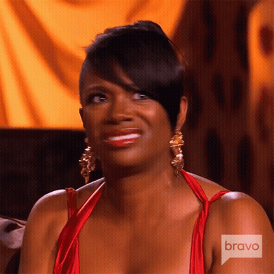 Woman In Red Dress And Gold Earrings On Bravo GIF