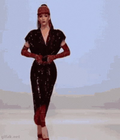 Woman In Red Dress And Heels On Runway GIF
