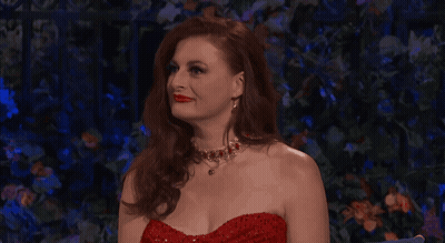 Woman In Red Dress And Necklace Looking Up GIF