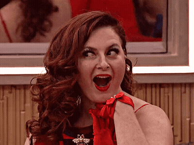 Woman In Red Dress And Red Gloves With Mouth Open GIF
