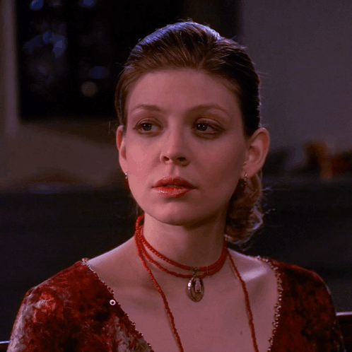 Woman In Red Dress And Red Necklace GIF