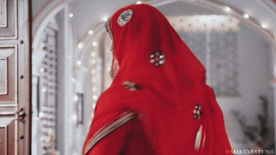 Woman In Red Dress And Veil Standing In Room GIF