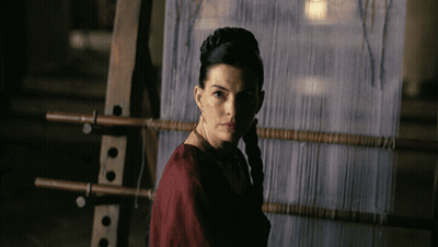 Woman In Red Dress At Loom In Dark GIF