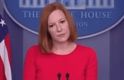 Woman In Red Dress At Microphone In Front Of White House Sign GIF