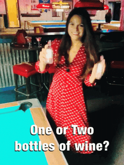 Woman In Red Dress At Pool Table Saying One Or Two Bottles Of Wine GIF