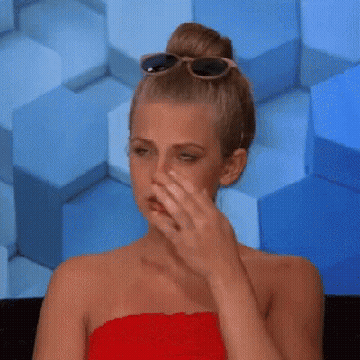 Woman in Red Dress Covering Mouth