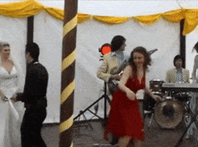 Woman In Red Dress Dancing In Front Of Drummer GIF