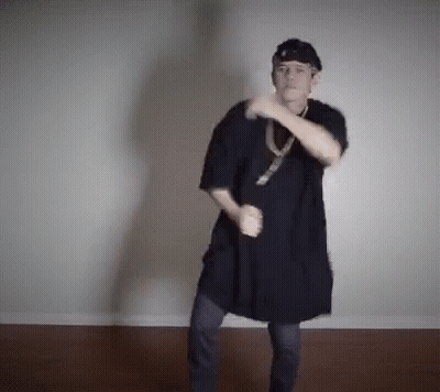 Woman In Red Dress Dancing In Living Room GIF