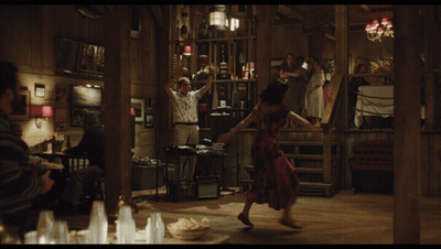 Woman In Red Dress Dancing In Wooden Room GIF