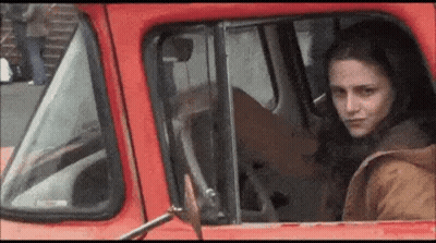 Woman In Red Dress Dancing On Highway GIF