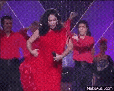 Woman In Red Dress Dancing On Stage GIF