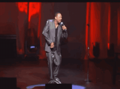 Woman In Red Dress Dancing Under Disco Ball Saying Hey Cutie GIF