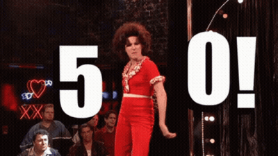 Woman In Red Dress Dancing With 5 And 0 Above GIF