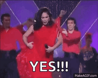 Woman In Red Dress Dancing With Dancers GIF