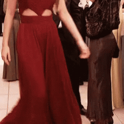 Woman In Red Dress Dancing With Man In Black GIF