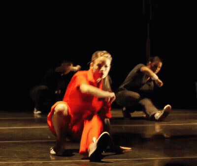Woman In Red Dress Dancing With Man In Black Shirt GIF