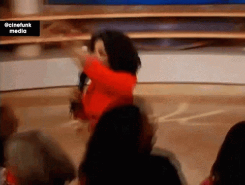 Woman In Red Dress Dancing With Microphone GIF