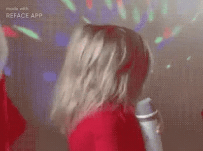 Woman In Red Dress Dancing With Microphone In Disco GIF